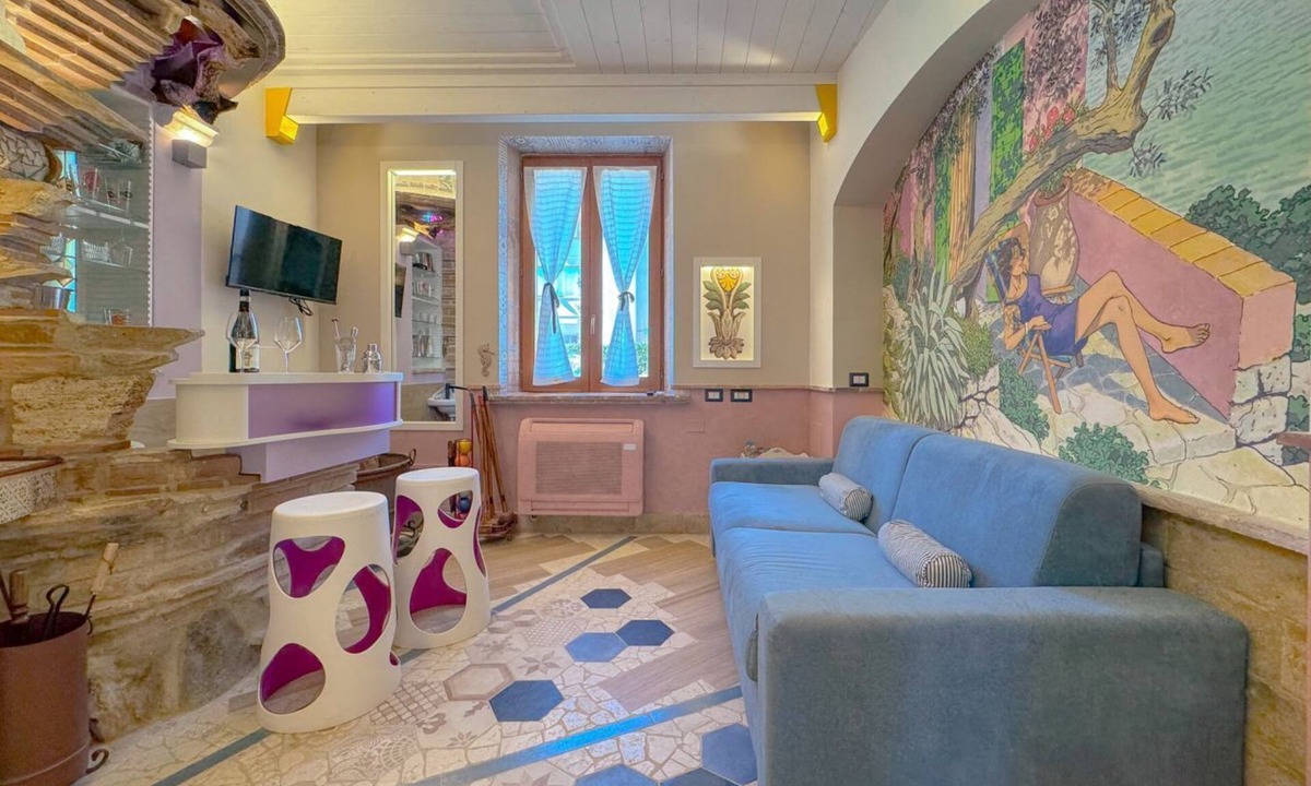 San Benedetto del Tronto Apartment | Il Cielo in Una Stanza is a stylish ground floor apartment within Villa Antolina Apartments in San Benedetto del Tronto. Just 5 minutes from the beach, it features 2 double bedrooms, spacious living with kitchen, fireplace and bar, WiFi, smart TVs in all
