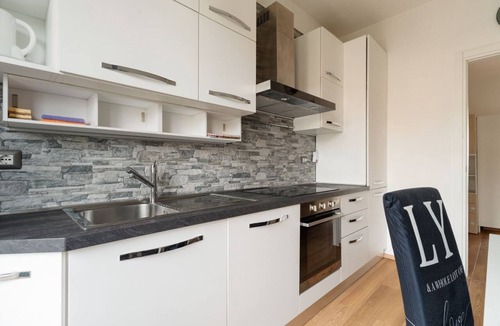 Milan Apartment | A cozy 70 sqm apartment, ideal for 4 people, located on the 4th floor of a building with an elevator.The property is situated in the Quartiere degli Olmi, a residential area in western Milan.Surrounded by expansive green spaces, the neighborhood offers a