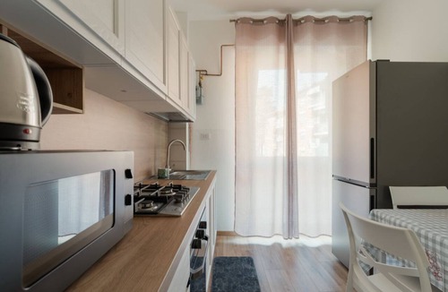 Comasina Apartment | A cozy 82 sqm apartment, ideal for 5 people, located on the first floor of a building with an elevator.The property is situated in Comasina, a residential area rich in amenities and green spaces, right next to Parco Nord Milano.The Comasina M3 metro stat