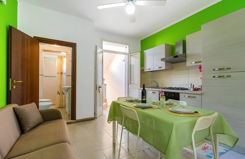 Torre Lapillo Apartment | Apartment 'Due Passi Dal Mare Primo Piano' with Sea View, Shared Terrace and Air Conditioning