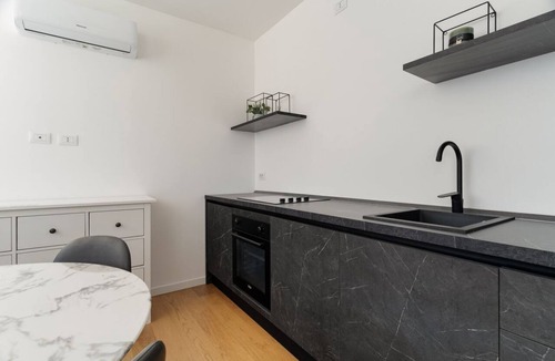 Milan Apartment | Cozy 41m2 apartment, ideal for 4 people, located in the basement (stairs to access).The accommodation is located in the Harar district, an architectural project designed to respond to post-war housing needs, structured around large green areas and thanks