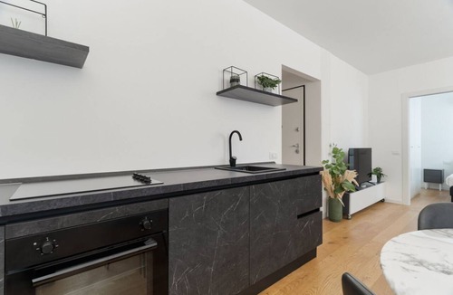 Milan Apartment | Cozy 41m2 apartment, ideal for 4 people, located in the basement (stairs to access).The accommodation is located in the Harar district, an architectural project designed to respond to post-war housing needs, structured around large green areas and thanks