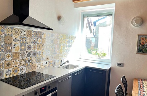 Naggio Apartment | 'Crooked House' Apartment with Mountain View, Private Garden and Parking