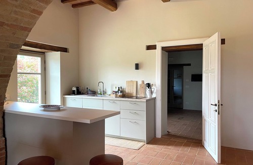 Marsciano Apartment | Deluxe Cypress Suite: vaulted living room and pool