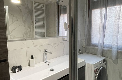 Santa Rita Apartment | Elegant apartment with private parking, a 5-minute walk from INALPI ARENA
