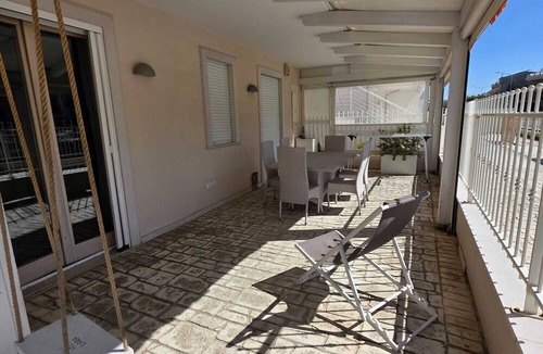 Lido di Fermo Apartment | Elegantly renovated beachfront apartment with a courtyard and parking space