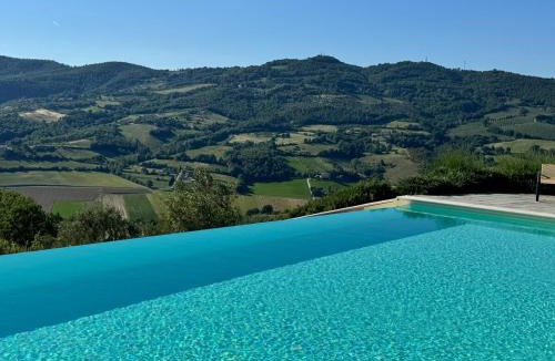 Umbertide Apartment | Heated Infinity Pool - Restored Farmhouse & Views