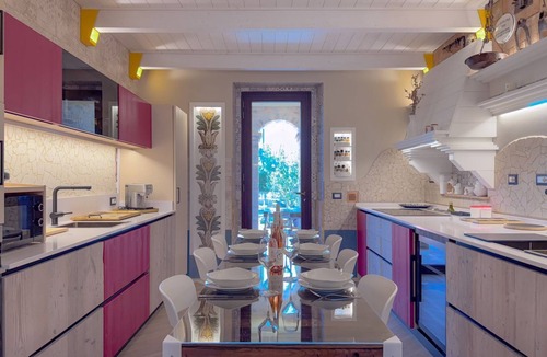 San Benedetto del Tronto Apartment | Il Cielo in Una Stanza is a stylish ground floor apartment within Villa Antolina Apartments in San Benedetto del Tronto. Just 5 minutes from the beach, it features 2 double bedrooms, spacious living with kitchen, fireplace and bar, WiFi, smart TVs in all
