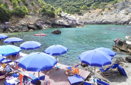 Cala Piccola Apartment | Relax and sea: one room with patio and pool