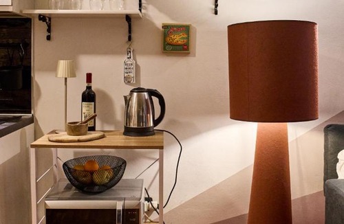 Roman Quarter Apartment | Nicma, a small candy box in the center