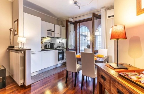 Ticinese Apartment | Prada House: Modern Comfort with Terrace and Parking in Milan