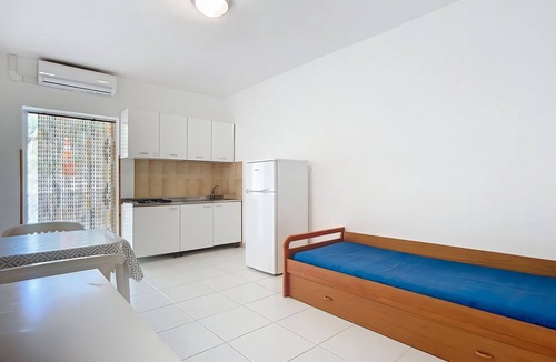 Chiesiola Resort | Property in the holiday village 'Baia Falcone - Standard 306' with sea view and air conditioning