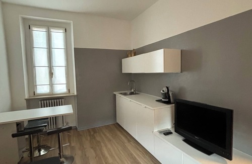 Treviglio Apartment | Relaxing apartment with terrace among the rooftops of an old building.