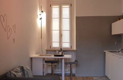 Treviglio Apartment | Relaxing apartment with terrace among the rooftops of an old building.