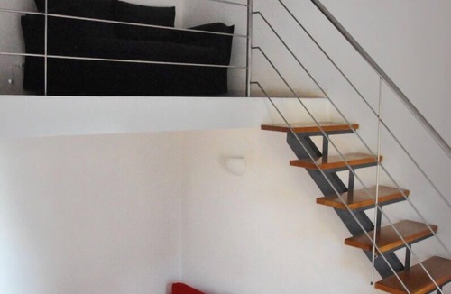 Rione XVIII Castro Pretorio Apartment | Rome: Sleeping space and living room - two levels between Repubbli