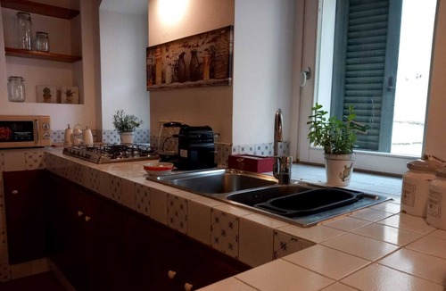 Matera Apartment | Roots - The window in the Sassi
