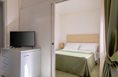 Marina di Cecina House | Studio apartment of approximately 20 m2 composed of a living room with kitchenette equipped with 2 induction hobs, small fridge, sink,satellite TV and sofa.Sleeping area separated by sliding door with double bed, bathroom with shower without window.Air c