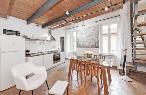 Monti Apartment | Suite Frangipane: beautiful penthouse overlooking the Roman Forum and the Colosseum