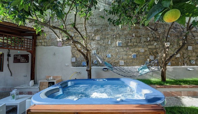 Apartment immersed in a lemon grove oasis with an enveloping whirlpool