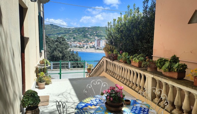 Apartment in villa on beach in greenery, in center