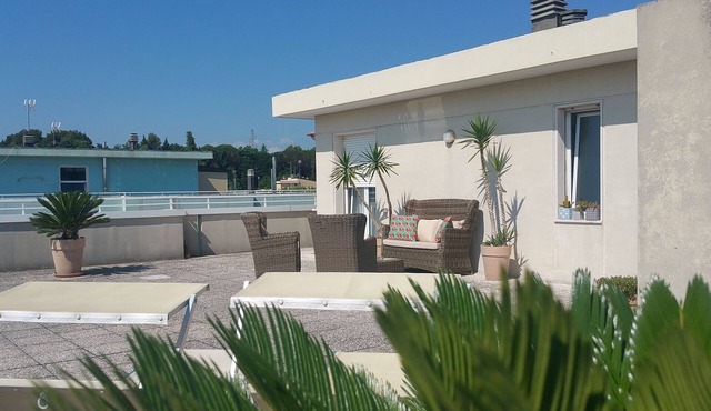 Cristina’s flat, a cozy attic with roof garden next to the beach