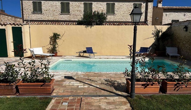 House in a village with swimming pool