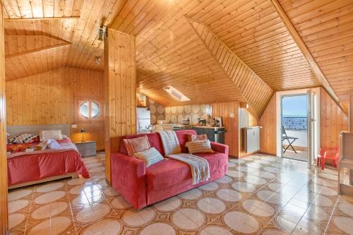 La Mansarda Sul Lago: Rustic Attic Studio with Balcony & Parking - Happy Rentals