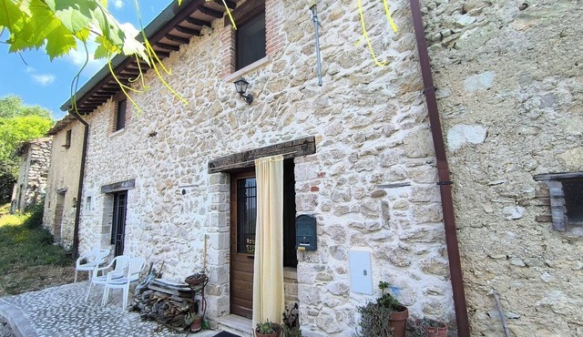 Stone farmhouse on Lake Turano