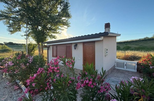 Roseto degli Abruzzi Cottage | A guesthouse with a fireplace in the garden of a villa with a pool; the beach is 5 minutes away