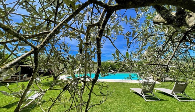 Centrally located villa in lush grounds and gardens with exclusive pool.